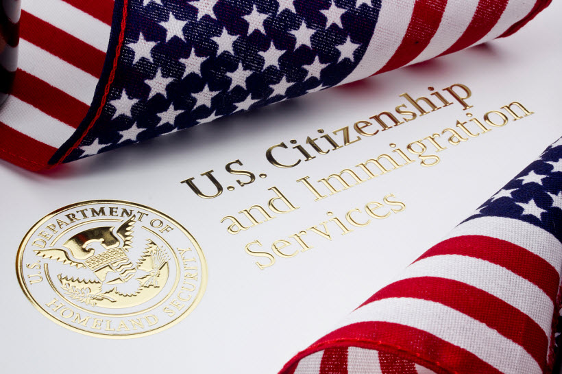 US citizenship and Immigration Services letterhead and USA flags